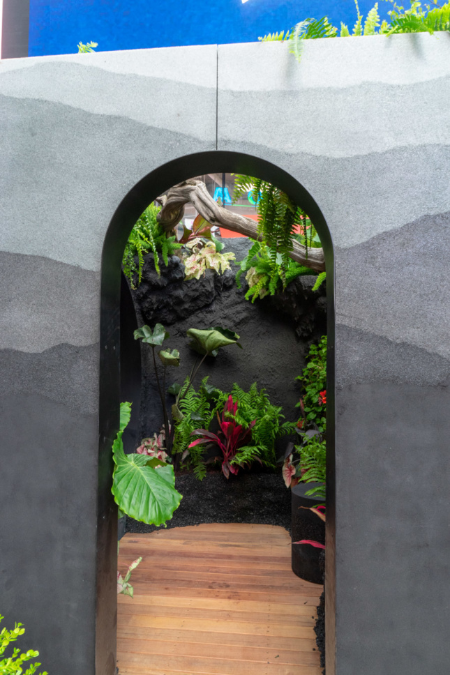 Portrait photo of a contemplative garden through a narrow vertical portcullis 