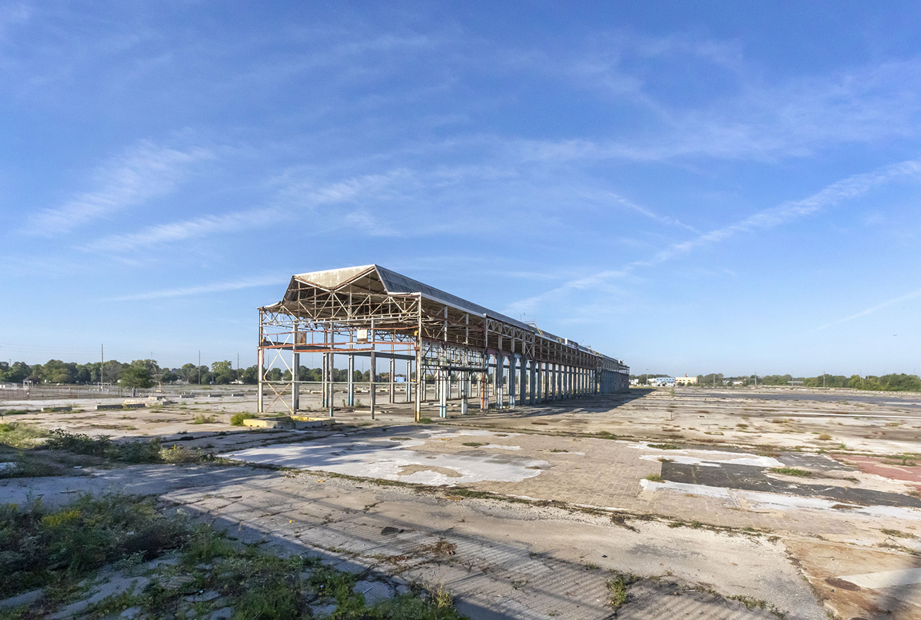 Photo of An empty lattice structure on a barren industrial site