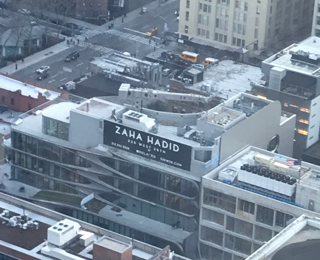 Aerial photo of billboard saying "ZAHA HADID" on 520 West 28th Street condo building