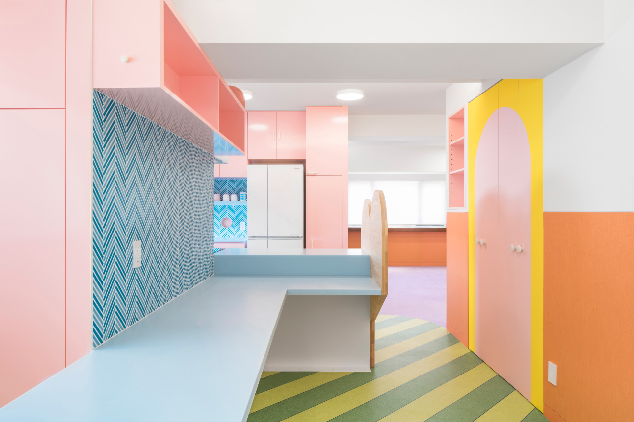 Photo of a kitchen with brightly colored and patterned surfaces