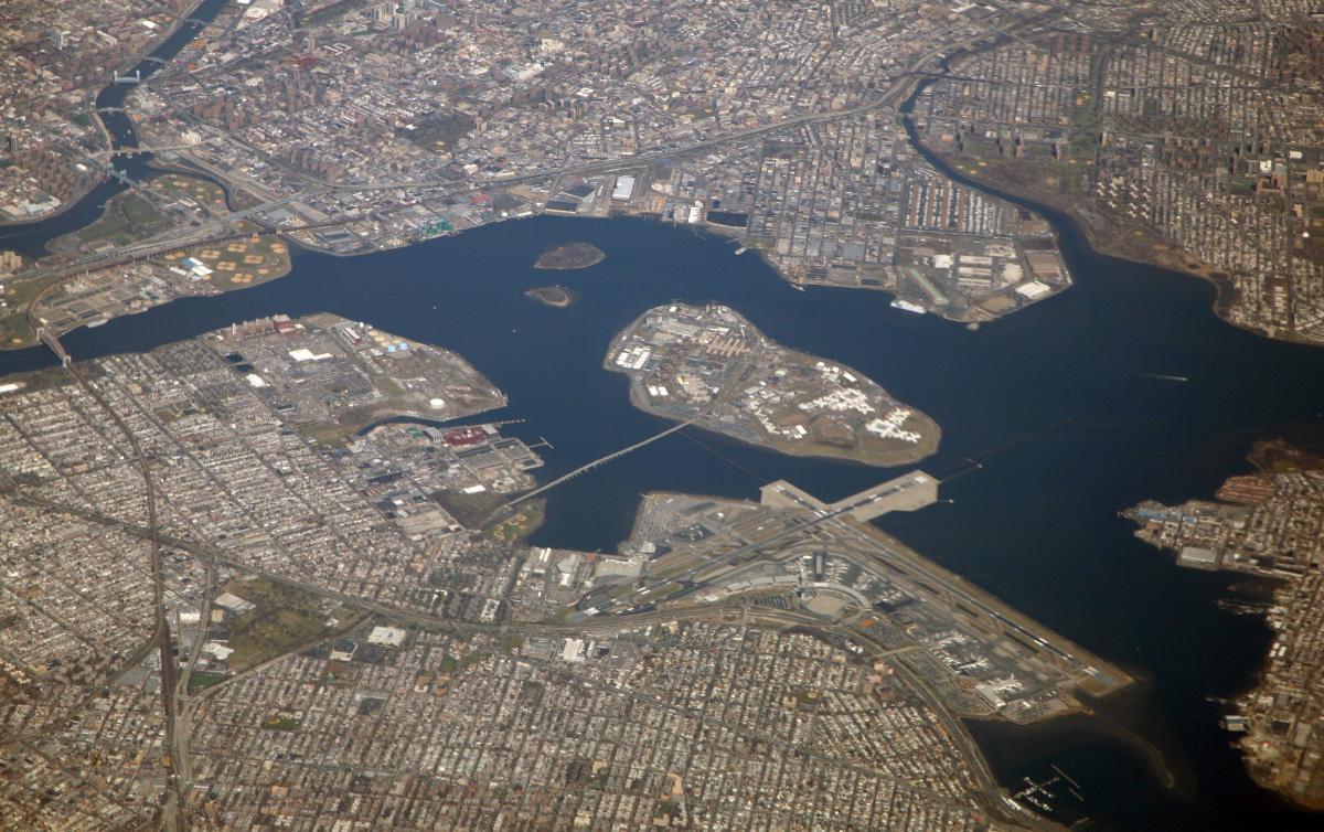 Aerial photo of Rikers Island, connected to the mainland by only one bridge