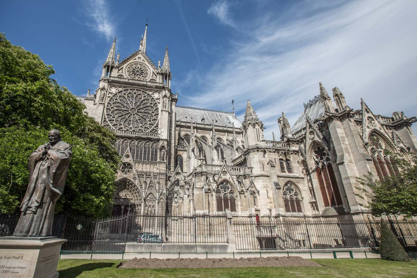 Photo of Notre Dame Cathedral in Paris: A limestone church with an enormous rose window