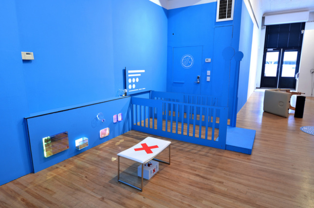 A blue-painted room with a white table in the center