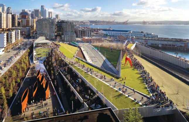 An aerial photo of a jagged elevated park on a waterfront in Seattle, designed by the New York firm Weiss/Manfredi