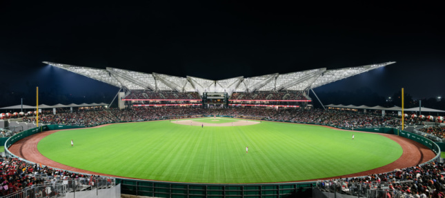 Wide-angle view of the new Diablos Rojos Stadium from the turf, looking towards covered stadium seating