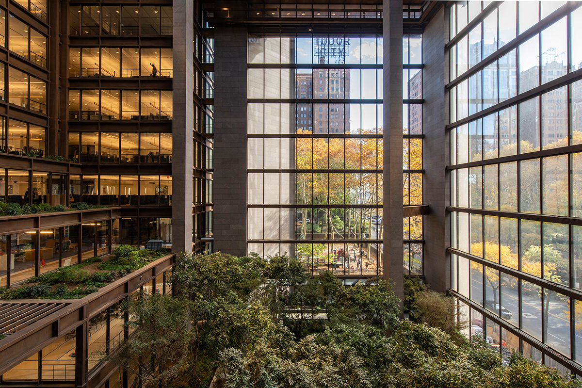 Photo of atrium inside ford foundation with trees and glass walls