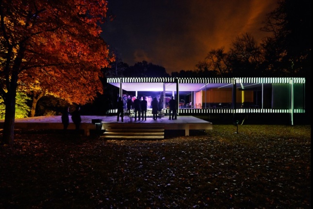 The Farnsworth House illuminated in black-and-white lines, and purple interior lighting