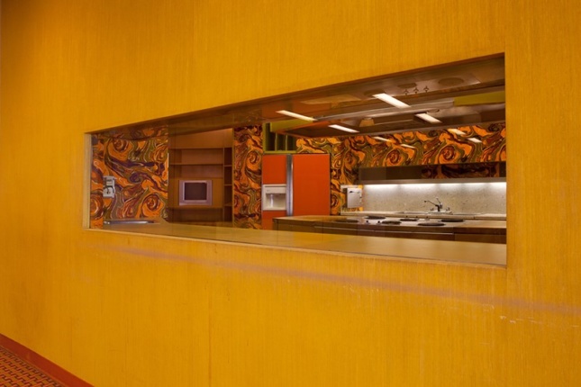 View inside the test kitchen orange walls