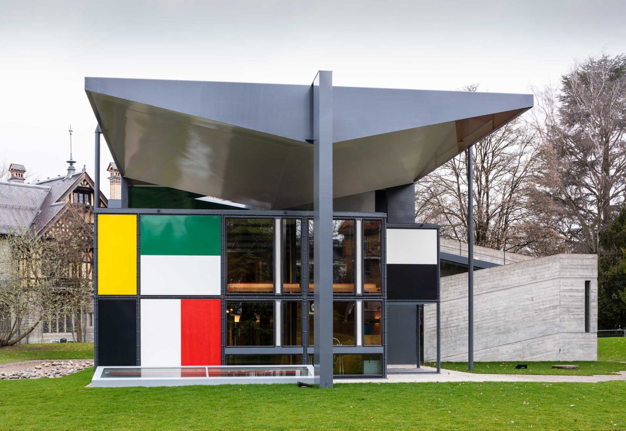 A modernist-style house with a colorful window wall; the Centre Le Corbusier