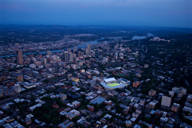 Aerial photo of a stadium against the skyline of Portland