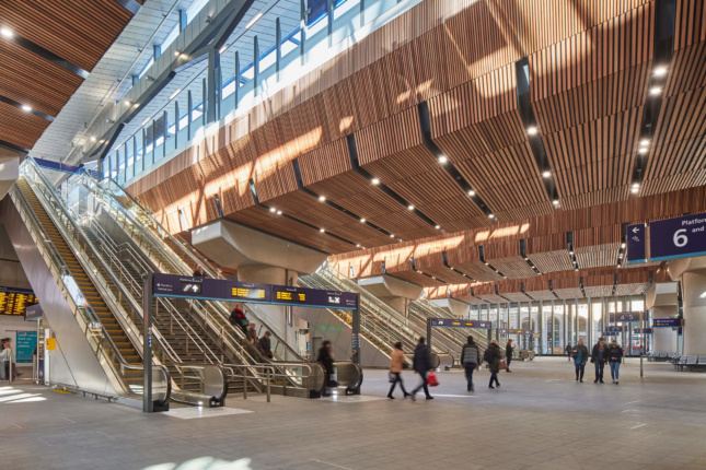 Photo of a rail station with timber-clad interior