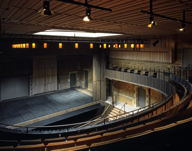 The interior of a subdued opera house