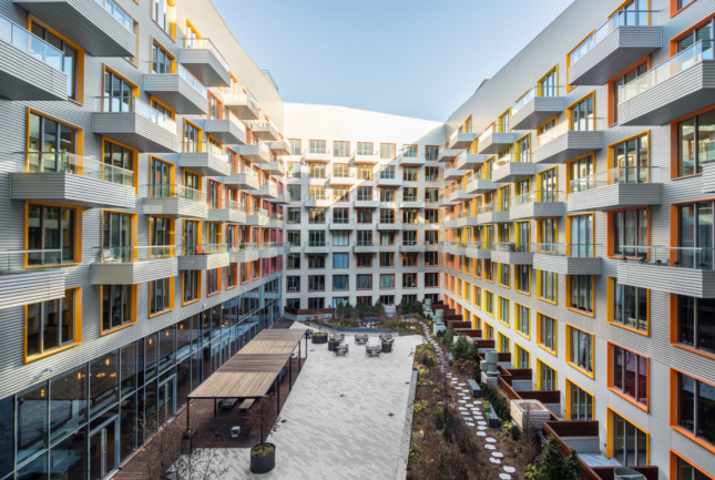 Photo of an interior courtyard boxed in by balconies