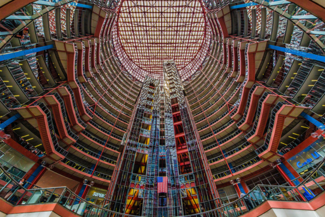 Looking up through the multicolored glass of the Thompson Center atrium