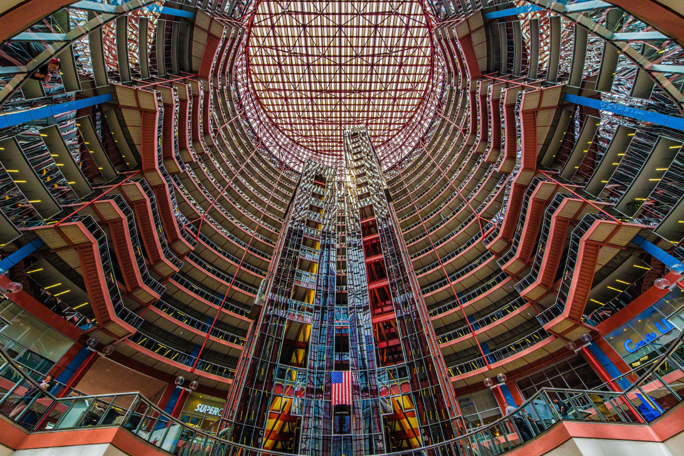 Looking up through the multicolored glass of the Thompson Center atrium