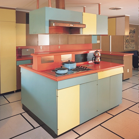 different color laminate surfaces cover an island kitchen