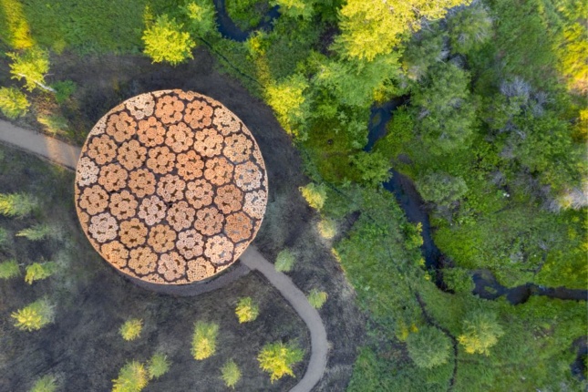 Aerial photo of Francis Kéré's pavilion made from timber logs