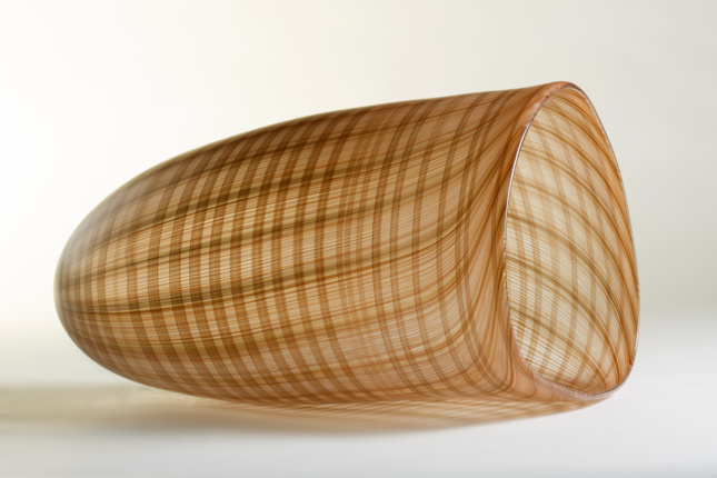 A glass vessel with a textured patterns 