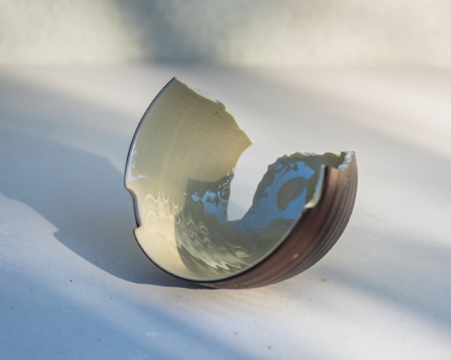 A broken bowl lying on the ground