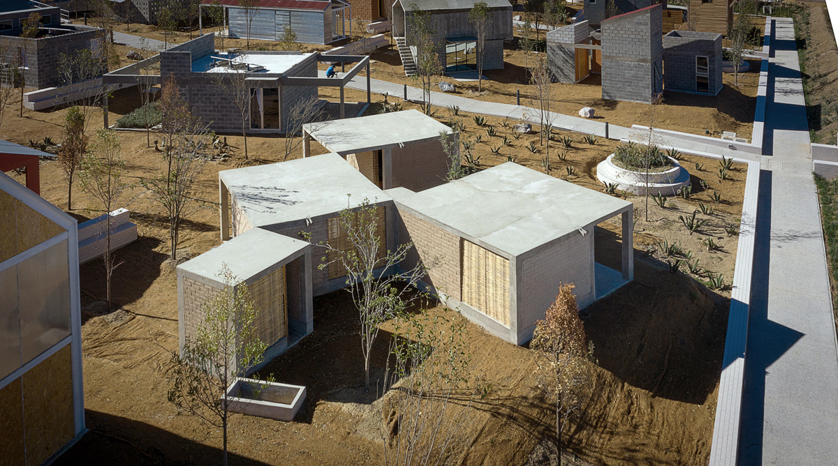 Aerial image of a four-room concrete house with a flat roof