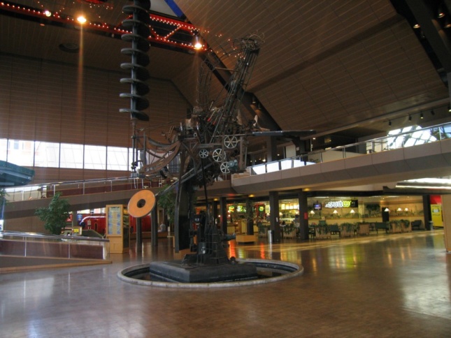 An interior image of Jean Tinguely's sculpture in the atrium of César Pelli's The Commons in Columbus, Indiana.
