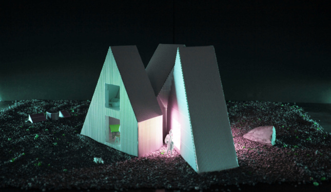 Physical model of three triangular cabins at night