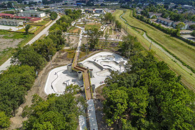 Aerial photo of BMX bowls in the forested area of the Rock Star Energy Bike Park with wooden ramp over top