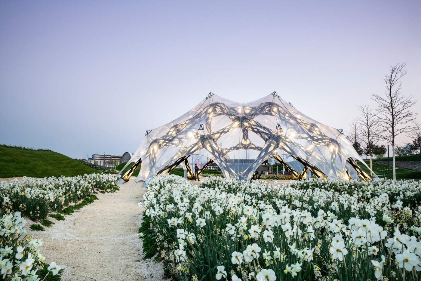 A pavilion with a clear skin in a field of flowers, for the BUGA horticulture show