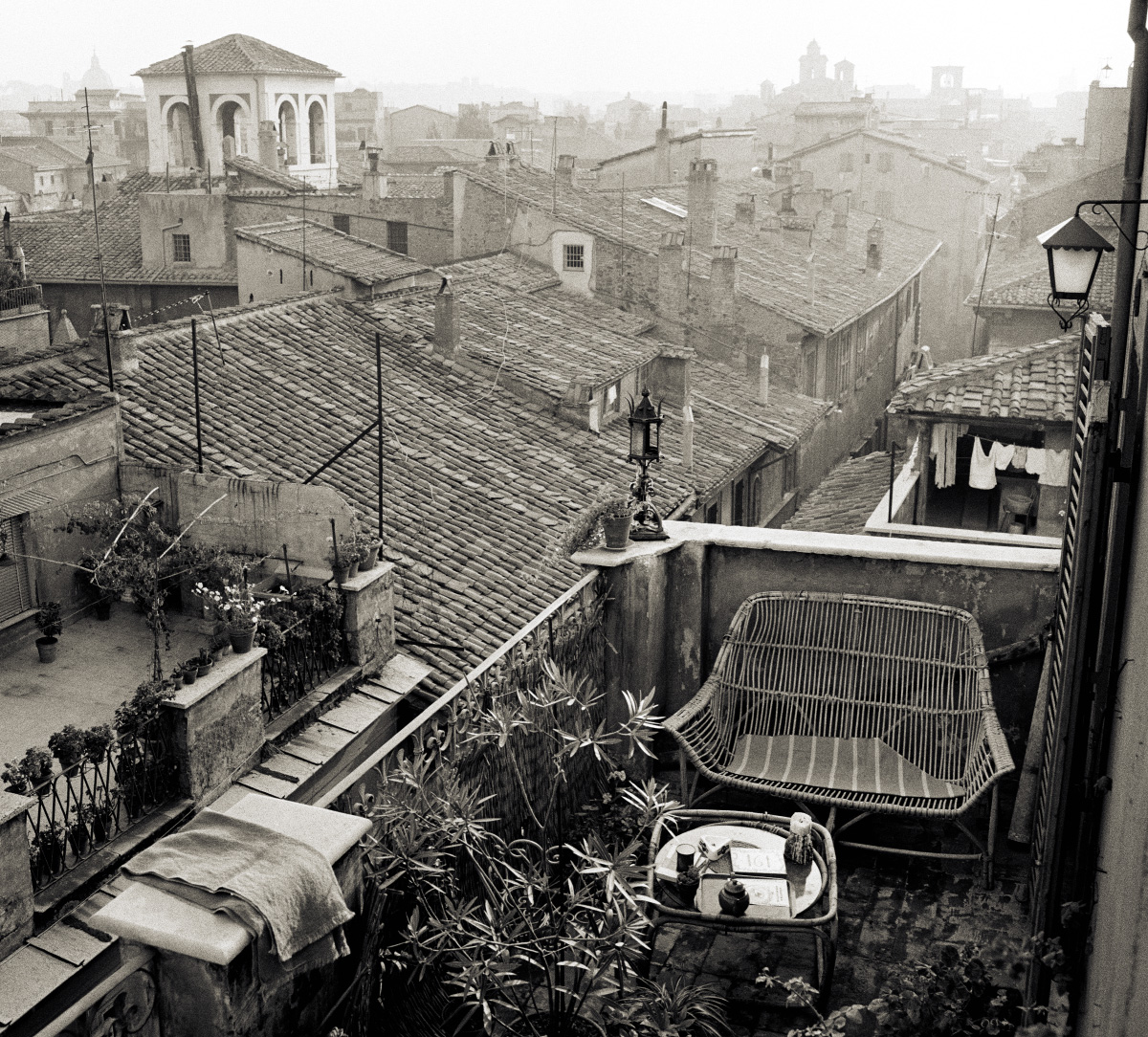 Black and white photo of rooftops in Rome, from the show and book 