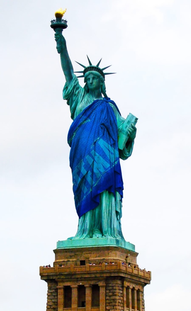 Photomontage of Statue of Liberty with FEMA tarp as its sash