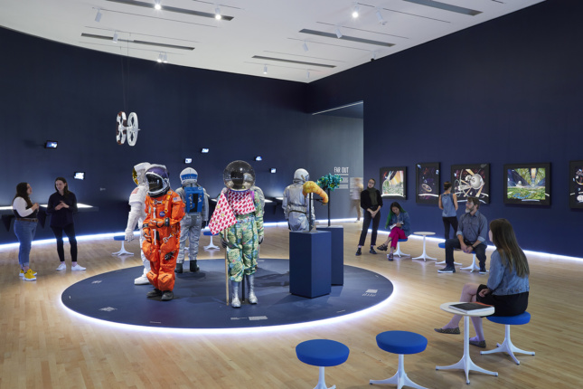 Interior of a gallery with spacesuits