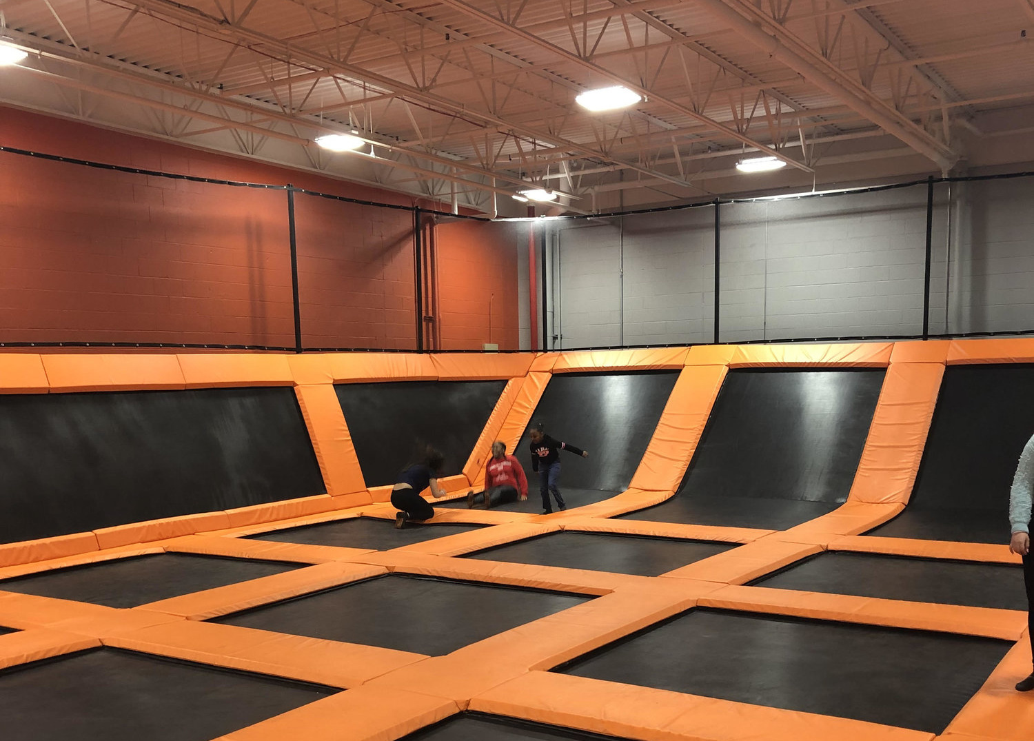 Image of kids bouncing on wall to wall trampolines