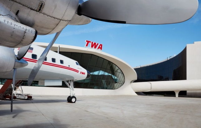 View of TWA Hotel next to Flight Center with Connie airplane on tarmac