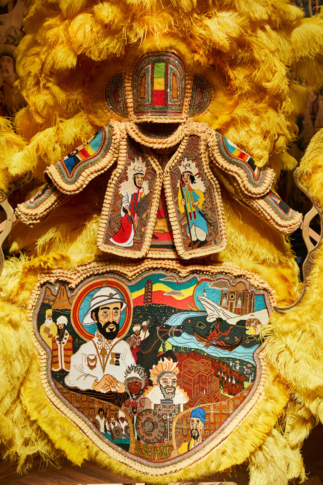 Detail view of an embroidered, celebratory yellow suit, part of the London Design Festival