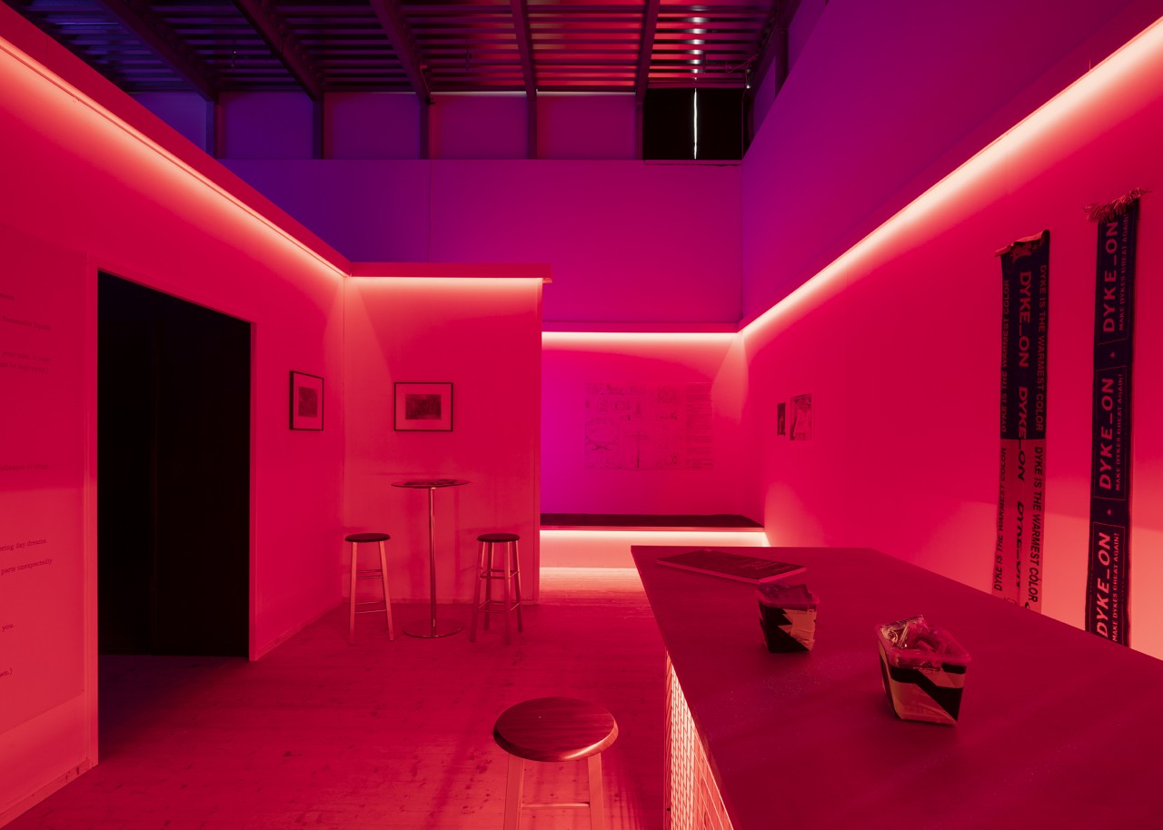 Interior of the Cruising Pavilion, presenting a dark, red room