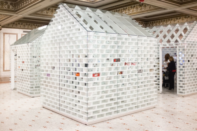 White "houses" installed inside a Beaux Arts interior for the 2019 Chicago Architecture Biennial