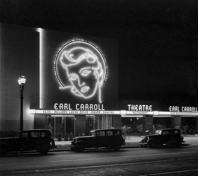 A black and white photo of a theater with the words 