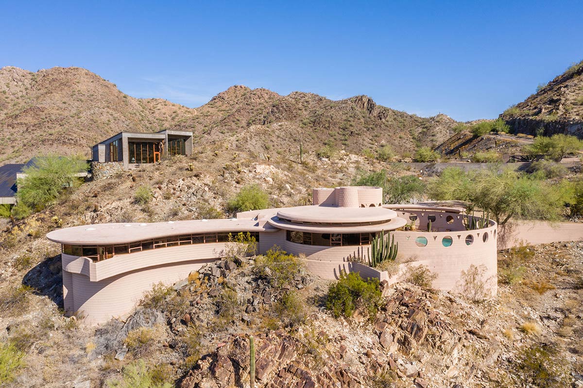 Aerial photo of a round home set against the desert landscape, the Norman Lykes house