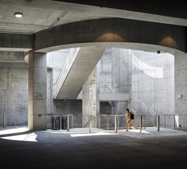 Interior view of light-filled parking garage in precast concrete below Washington University