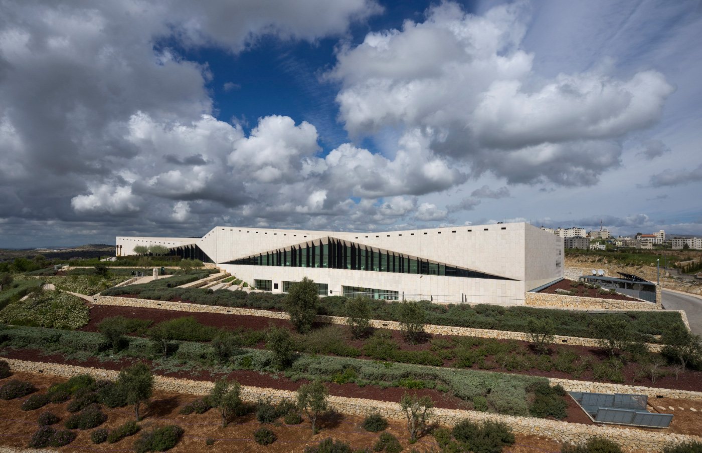 Exterior photo of the Aga Khan prize-winning museum, low-slung and clad in limestone