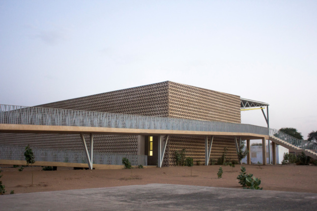 A building clad entirely in perforated triangular blocks