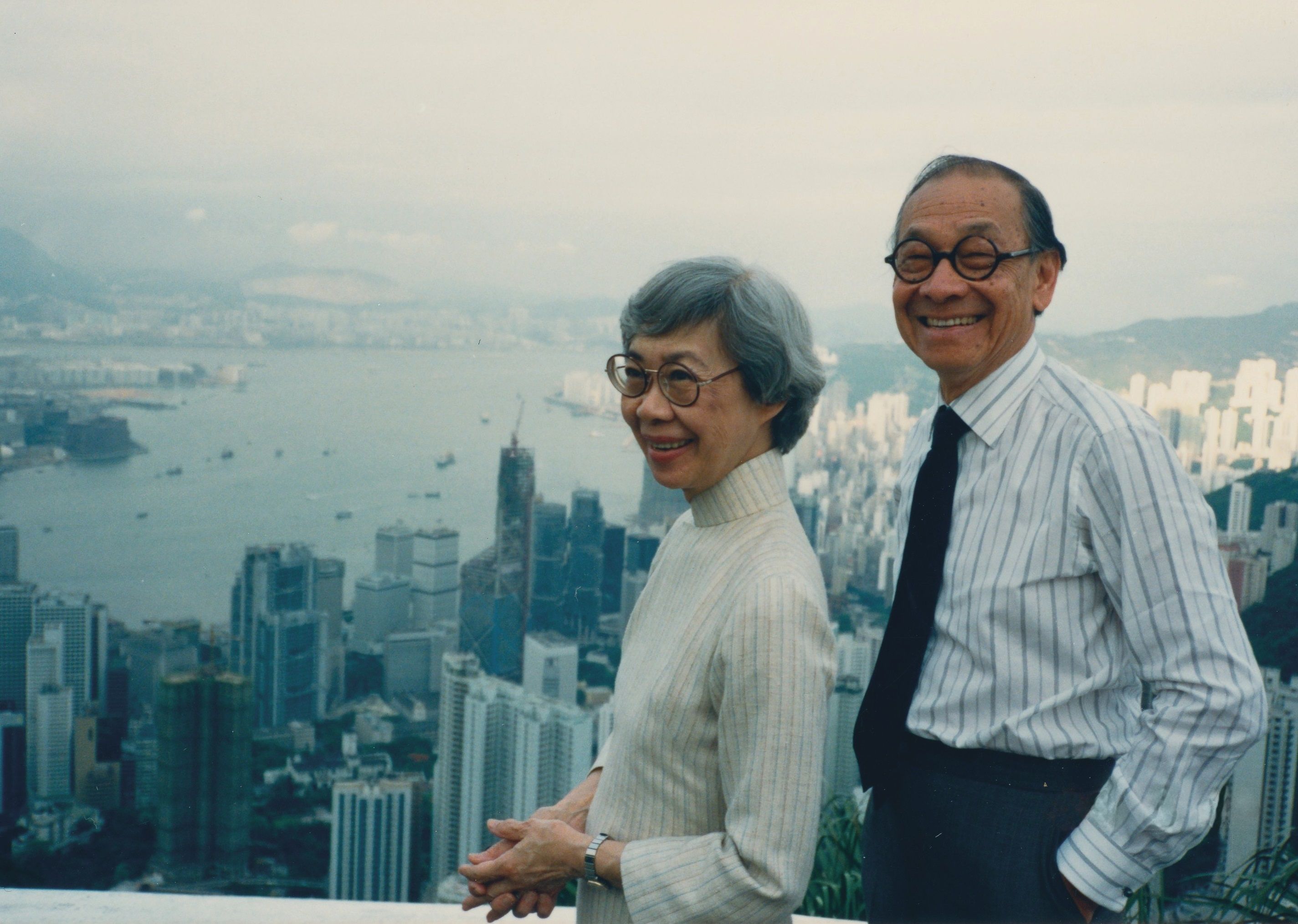 A photo of a man, I.M. Pei, and woman against a skyline