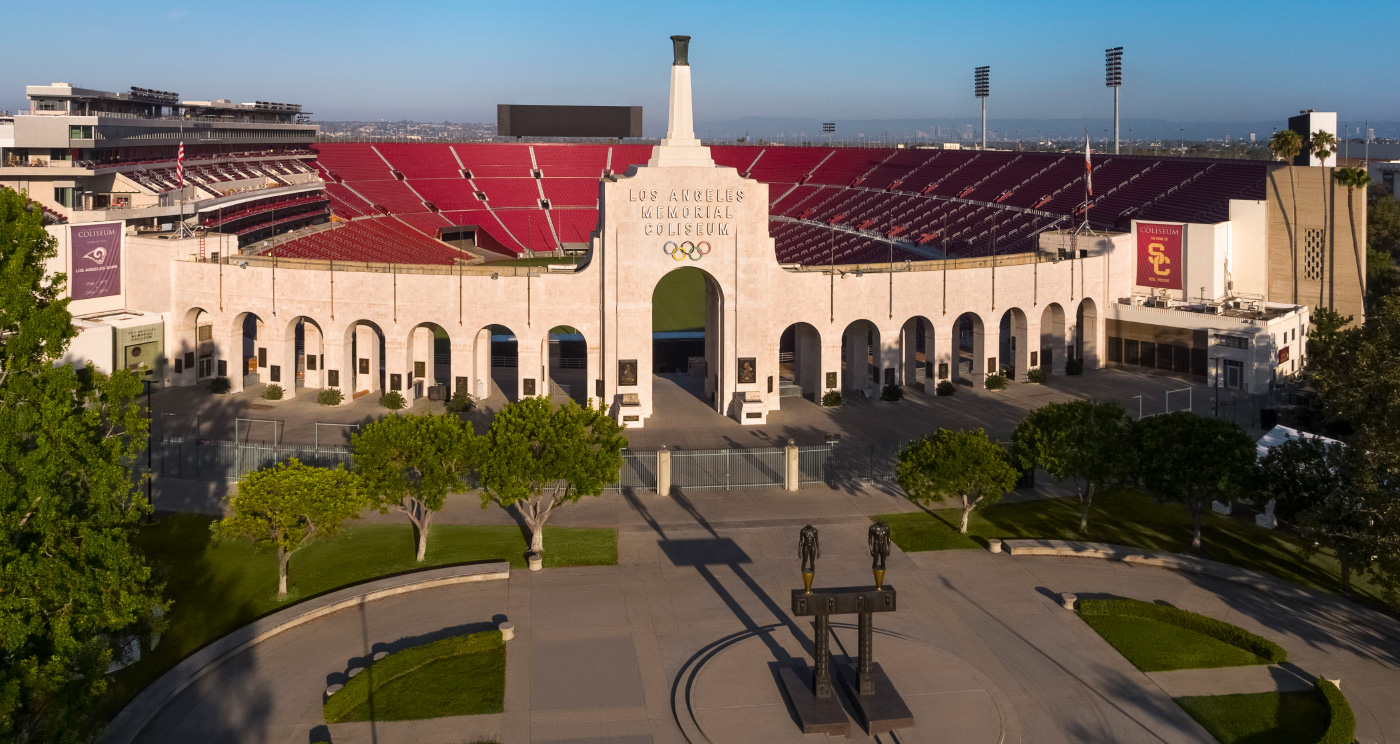 Photo of the Los Angeles Coliseum, featuring red seats around a field