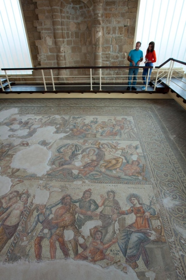 People looking at a mosaic floor