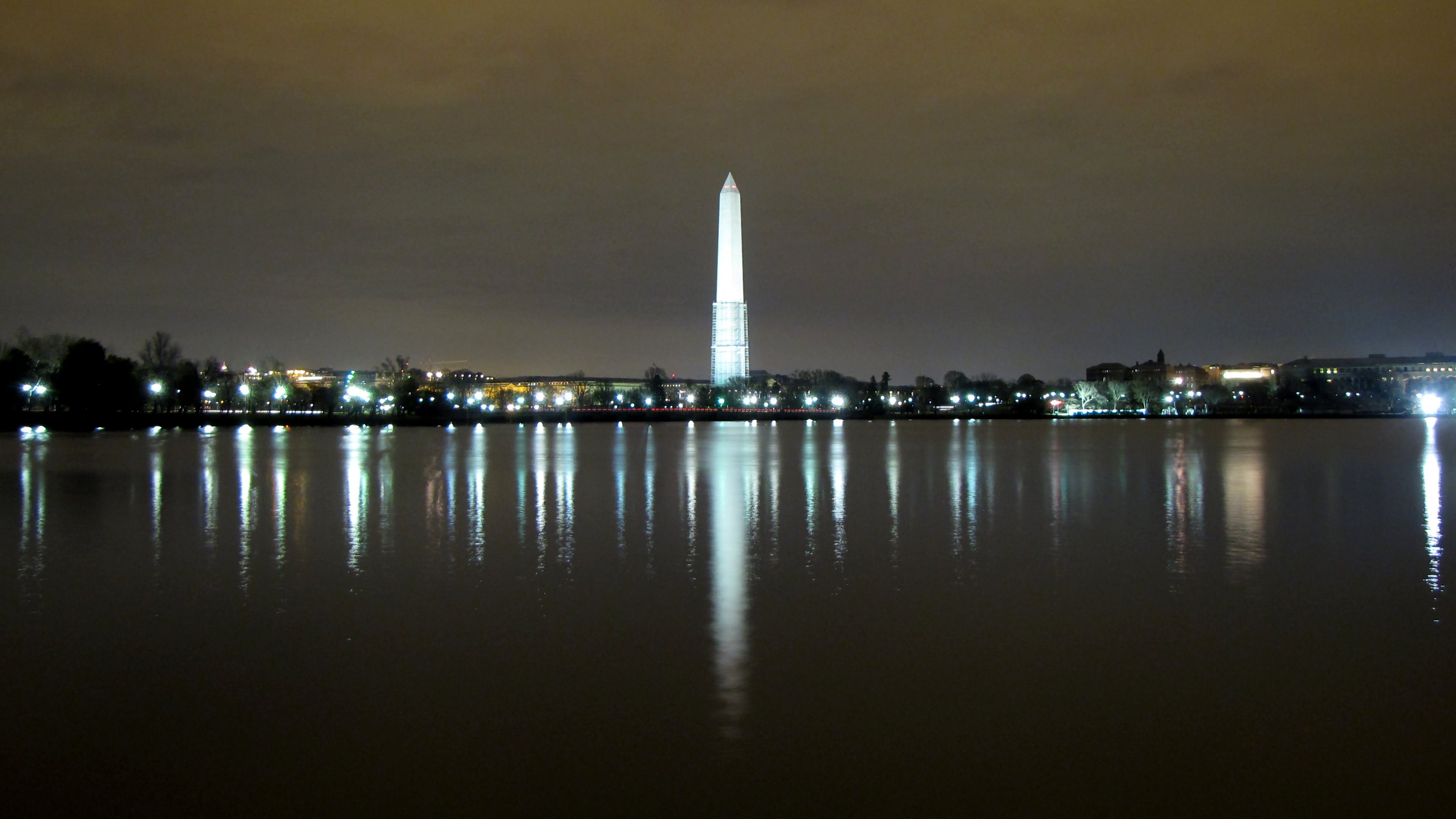 Photograph of the view of the Washington Monument from across the Tidal Basin at night.
