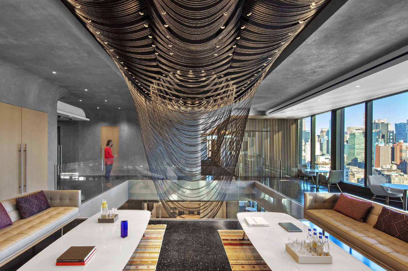 Interior of a concrete office with a bead curtain, designed by Aaron Schiller