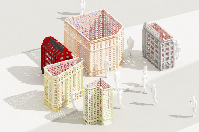 architectural models of new york's flatiron district sit on a table