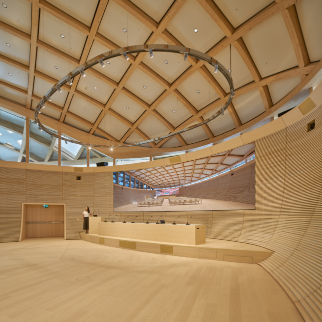 A wood-clad theater with coffered ceilings