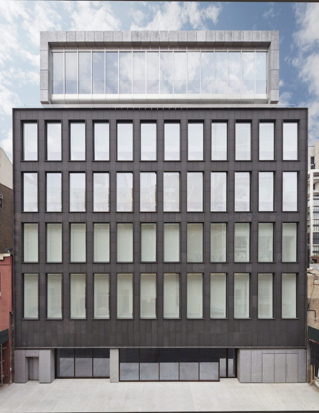 Image of the primary north elevation of the new Pace Gallery clad in volcanic stone.