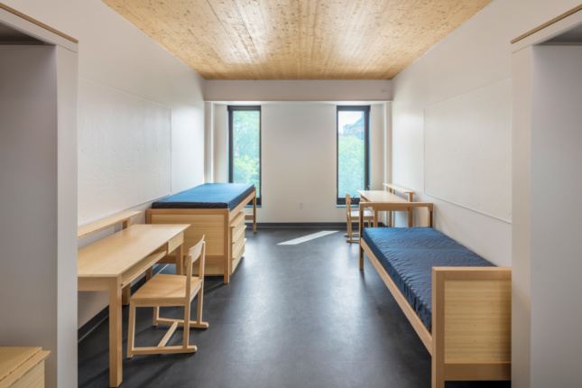 Interior of a dorm room at RISD with a timber ceiling